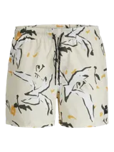 Short de baño de tiro medio con estampado botánico abstracto en tonos blanco, negro y amarillo sobre base color crema. Cuenta con cintura elástica con cordón ajustable, bolsillos laterales y bolsillo trasero.