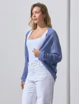 Cárdigan tejido color beige, marca Joseph A, de mangas largas y calado con motivos florales.