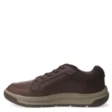 Zapatos casuales Caterpillar modelo Apa Cush, color marrón café, confeccionados en cuero con cordones y suela de goma en tono beige.