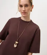 Remera de algodón Marfinno con corte boxy, cuello redondo y mangas cortas amplias, de diseño liso y holgado.