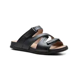 Sandalia de cuero color rosa con detalles dorados, tiras cruzadas con ajuste de velcro y suela blanca.