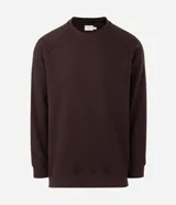 Buzo masculino de textura waffle, con cuello redondo y mangas largas. Confeccionado en una mezcla de algodón y poliéster, presenta un diseño cerrado y minimalista.