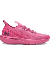Championes Under Armour modelo W Shift, color rosa vibrante. Presentan una parte superior de tejido elástico transpirable, clip de TPU en el talón con el logo de la marca y entresuela de EVA acolchada para mayor comodidad.