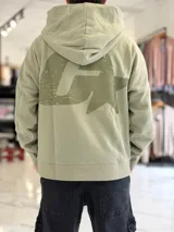 Canguro oversize gris con capucha y gran estampado gráfico trasero en tono más oscuro.
