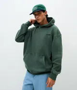 Hoodie de algodón verde con efecto acid wash, corte boxy, capucha y gran bordado en relieve con la palabra "horizon" en la espalda.