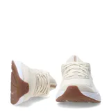 Championes de running Puma Skyrocket Lite 2, color beige con detalles en tono bronce. Presentan una estructura de malla transpirable, entresuela blanca de amortiguación reactiva y suela de goma en color marrón.