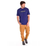 Remera azul con estampado amarillo con el logo de la marca Caterpillar.