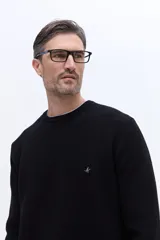 Sweater de cuello redondo con textura de tejido marcado, manga larga y puños acanalados.