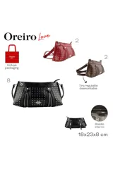 Cartera bandolera color marrón con acabado brillante, decorada con múltiples tachas metálicas plateadas y cierres decorativos frontales. Incluye un aplique metálico en forma de labios en el centro y correa ajustable.