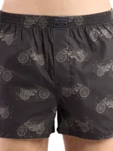 Bóxer de algodón blanco con estampado de flores pequeñas color celeste, con cintura elástica y logo de la marca en el centro.