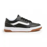 Championes Vans modelo Hylane, de diseño urbano con capellada de cuero sintético negro, franja lateral característica en blanco, suela de goma blanca y base de caucho color caramelo.
