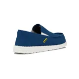 Zapato casual de hombre tipo slip-on, color azul marino, con elásticos laterales y suela blanca.
