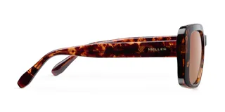 Lentes de sol con montura oversized cuadrada de diseño bold y cantos suavizados. Presentan un estampado carey en la montura y lentes polarizadas color marrón con protección UV400.