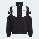 Campera deportiva Adidas Blocked de diseño bicolor en negro y blanco, con cuello alto, cierre frontal y bolsillos laterales. Presenta el logo del Trifolio bordado en el pecho.