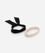 Kit de dos diademas para el pelo, una negra con lazo y otra rosa lisa.