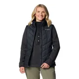 Chaleco acolchado Columbia Heavenly II Vest color negro, con diseño matelasseado en diagonal, cuello alto y cierre frontal de dos vías. Incluye tecnología Omni-Heat y Omni-Shield.