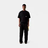 Camiseta negra de corte holgado con estampado en la espalda que incluye el logo de Eme Studios y la frase "Always grateful for my roots, crafted with care © 5135, veteran collection".