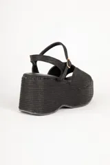 Sandalias negras de yute con hebilla ajustable y plataforma alta de 8cm.