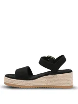 Sandalias de plataforma tipo espadrille con capellada de material sintético negro, tira ajustable al tobillo con hebilla metálica dorada y suela de yute con base de goma.