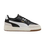 Championes urbanos Puma modelo Shuffle Downtown OG, con diseño de paneles en cuero negro y gamuza beige. Presenta la icónica franja lateral en blanco, suela de goma color crema y detalles en dorado.