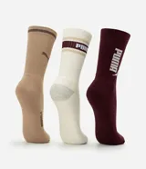 Pack de tres pares de medias de caña alta Puma de algodón. Incluye un par celeste, un par blanco con detalles verdes y un par verde oscuro, con logo de la marca estampado.