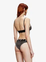 Bombacha de algodón elástico con efecto desgastado tipo denim, tiro medio y elástico en la cintura con logo Diesel aplicado.