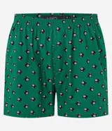 Calzoncillo tipo bóxer de tela tricolina color verde, con estampado de bolas ocho de billar en negro y blanco. Tiene cintura elástica y botones frontales.