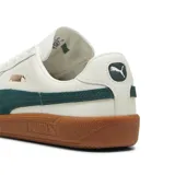 Championes Puma Army Trainer, color blanco con detalles en verde y suela marrón.