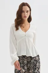 Babucha de viscosa con estampado floral en tonos marrones y beige, de corte recto y ajuste cómodo.