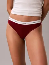 Colaless de tiro medio confeccionada en tejido de algodón acanalado con mezcla elástica. Presenta una banda elástica distintiva con el logo de la marca en contraste y diseño de pierna alta.