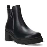 Botas cortas negras de cuero sintético, estilo chelsea con plataforma y taco grueso dentado. Cierre lateral con cremallera.