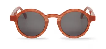 Lentes de sol Mr Boho modelo Dalston, con montura redonda color naranja texturizado y lentes grises.