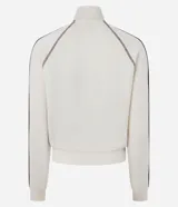 Campera deportiva de cuello alto con cierre frontal y bolsillos tipo canguro, en color beige con detalles marrones en las mangas y estampa localizada con texto "Phoenix Arizona".