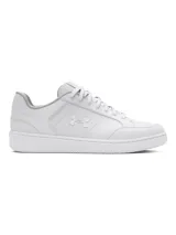 Championes Under Armour de estilo urbano, color blanco, con parte superior de cuero sintético y suela de goma al tono. Presenta el logo de la marca grabado en el lateral y cierre mediante cordones.