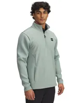 Buzo deportivo Under Armour Drive Pro Storm Hybrid para hombre, color verde agua, con cierre frontal parcial, cuello alto y logo en el pecho. Cuenta con tecnología Storm que repele el agua sin sacrificar la transpirabilidad.