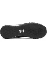 Championes de fútbol Under Armour Shadow Turf 3, diseñados para césped artificial. Presentan un diseño en color negro con detalles estampados en blanco y negro tipo pixelado. Cuentan con entresuela Charged Cushioning para absorción de impactos y suela de goma con tacos estratégicos para máximo agarre.