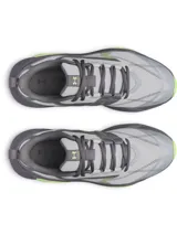 Championes de entrenamiento Under Armour Charged Commit TR 5, color gris con detalles en verde neón. Presentan parte superior de malla transpirable con revestimientos de cuero, entresuela Charged Cushioning para absorción de impactos y suela de goma con refuerzos laterales.