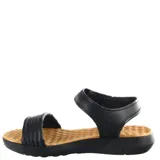 Sandalias Dijean modelo Tora, color negro con plantilla texturizada en color tostado. Presentan tiras anchas de material sintético y cierre de velcro en el tobillo para un ajuste seguro.