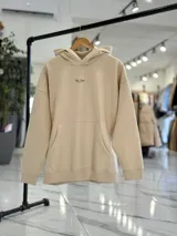 Canguro oversize de color beige con capucha y estampado en la espalda que dice "PUSH Through FEAR".