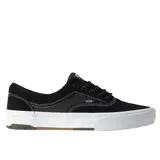 Championes Vans Skate Era Wafflecup de color negro con suela blanca y entresuela de goma marrón, costuras en contraste y cordones negros.