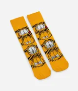 Medias de caña larga color amarillo con estampado repetido de diferentes expresiones faciales del personaje Garfield.
