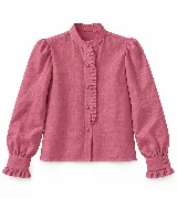 Blusa Candelaria de lino color rosado, con cuello mao, mangas largas abullonadas con puños con volados y detalle de volado sutil en la cartera de botones frontal.