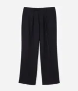 Pantalón de vestir beige de corte wide leg, con trabillas para cinto, bolsillos y diseño de sastrería.
