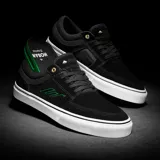 Championes de skate Emerica modelo The Hoban, color negro con detalles en verde y suela blanca. Presentan un diseño de perfil bajo con costuras reforzadas en la puntera y ojal superior metálico dorado.