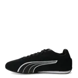 Championes Puma modelo Catch Sd, color negro con detalles en blanco. Diseño de perfil bajo con exterior de gamuza, cierre de cordones y suela de goma.