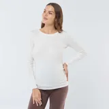 Camiseta de manga larga confeccionada en tejido de canalé, con cuello redondo y ajuste entallado.