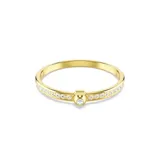 Brazalete rígido color dorado con cristales blancos engarzados y un cristal central de mayor tamaño.