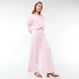 Pantalón palazzo de lino mezclado color rosa, de tiro alto con cintura elástica y corte amplio y fluido en las piernas.