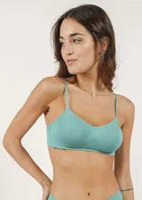 Soutien tipo top de microfibra sin costuras, sin aro y sin copas.