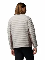 Campera híbrida Columbia con aislamiento térmico, diseño acolchado y paneles laterales elásticos. Cuenta con cierre frontal completo, cuello alto con protector de mentón y bolsillos laterales con cierre.